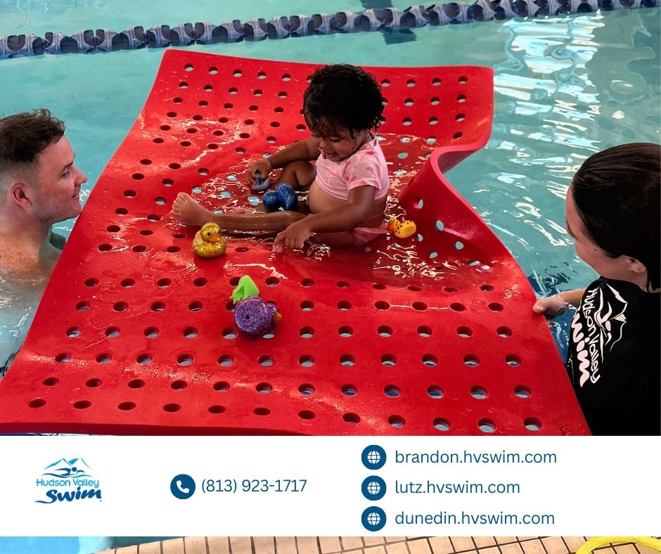 child learning to swim on a floating mat at hudson valley swim