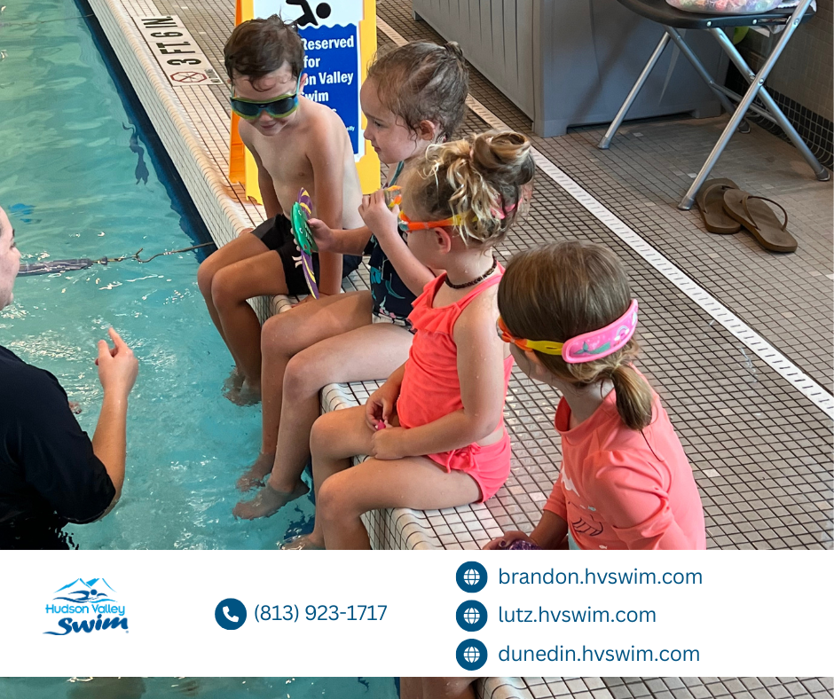 Kids sitting at the edge of a swimming pool during a swimming lesson at hudson valley swim dunedin