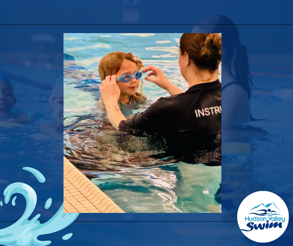 swim teacher adjusting students goggles