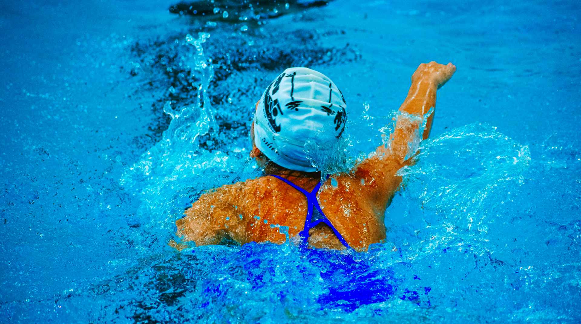 a swimmer in a pool at hudson valley swim learning about water safety