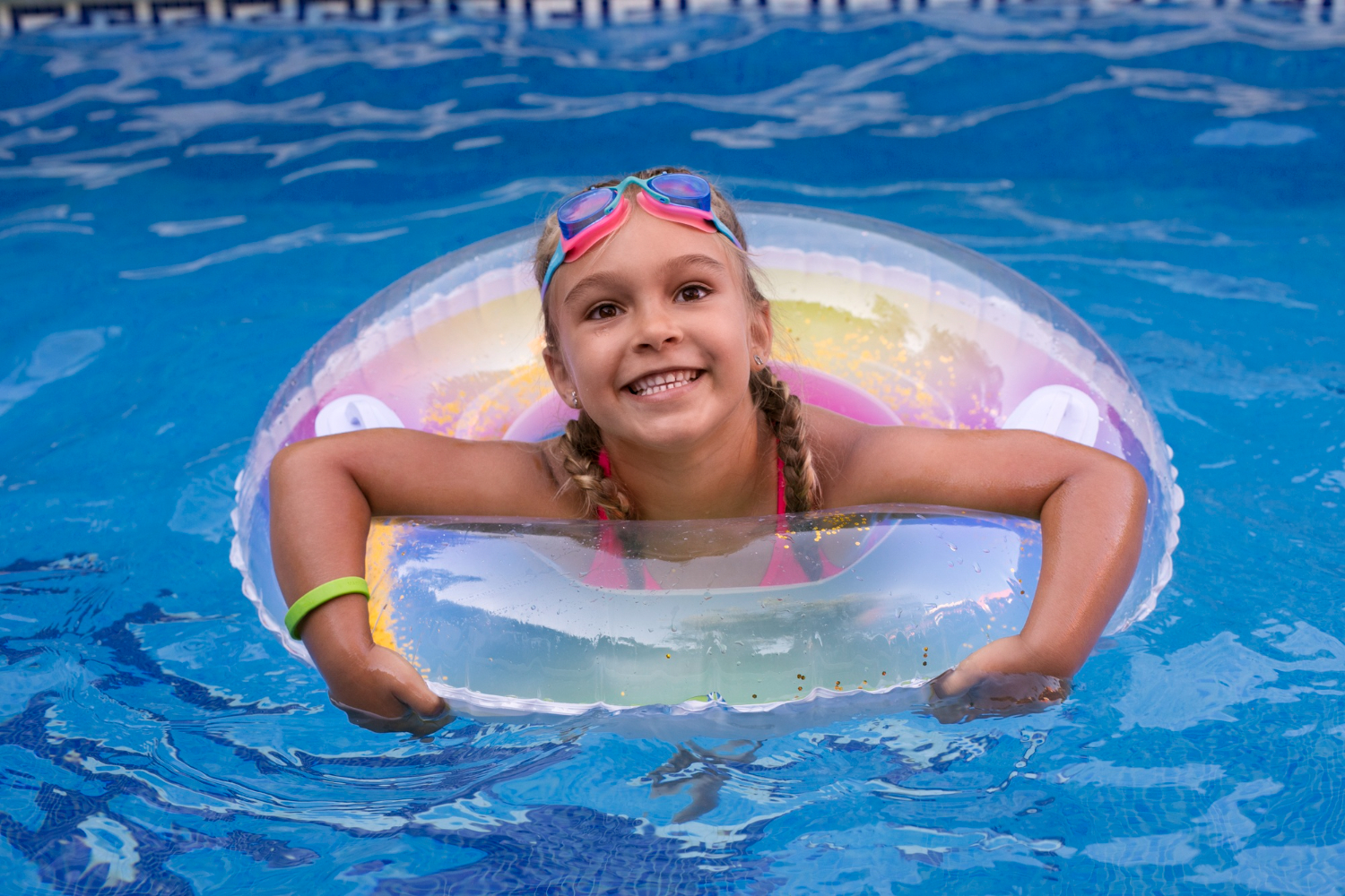 young girl in pool floaty