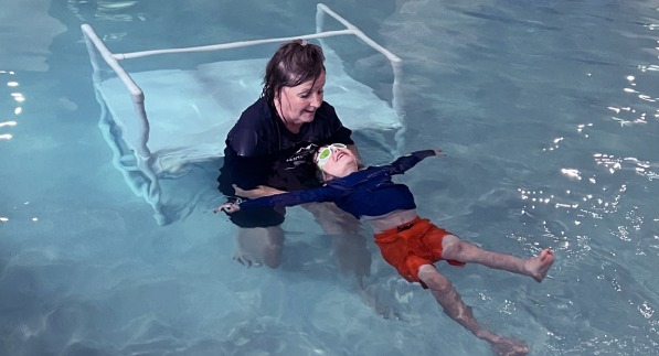 A young child getting swimming lessons at hudson valley swim